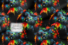 Laden Sie das Bild in den Galerie-Viewer, Baumwolljersey Gaming Colour Splash – 54596 – Bunte Gaming-Motive auf Schwarz. Stoffmuster.
